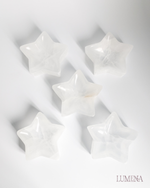Image shows five satin spar selenite crystal bowls, which have been carved into a star shape. Perfect for cleansing your crystals or adding a magical piece of decor to your room