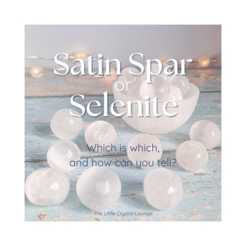 Image shows a collection of small Satin Spar Selenite spheres on a vintage blue wooden table. The text overlay reads "Satin Spar or Selenite? Which is which and how can you tell?"