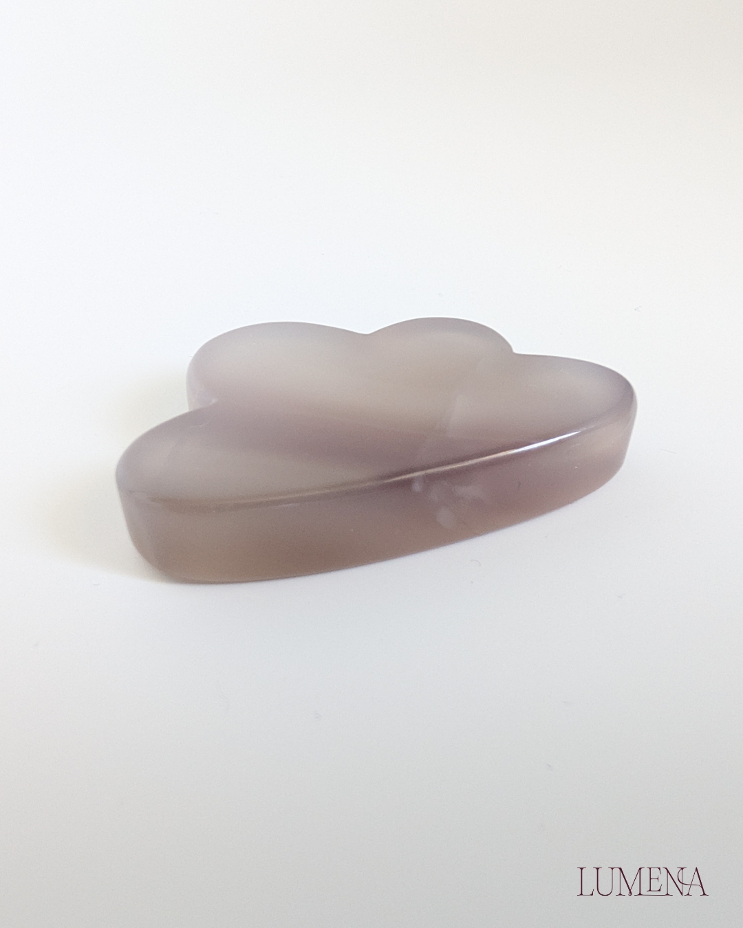 Image shows a grey agate crystal carved into a fun cloud shape